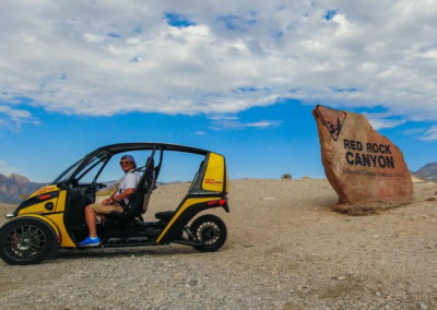 gocar parked near red rock canyon sign